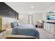 Comfortable main bedroom with a decorative accent wall, large window, and soft carpet flooring at 120 Parson Ln, Statesville, NC 28625