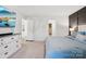 Comfortable main bedroom with a decorative accent wall, large window, and soft carpet flooring at 120 Parson Ln, Statesville, NC 28625