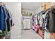 Spacious walk-in closet with ample hanging space and a central dresser for organized storage at 120 Parson Ln, Statesville, NC 28625