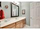 Bathroom features a long wood cabinet, a white sink, and grey-blue walls at 125 Highland Forest Dr, Clover, SC 29710