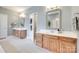 This bathroom features double sinks with wood cabinets, large mirrors, and modern fixtures at 125 Highland Forest Dr, Clover, SC 29710