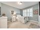 Bedroom features a white metal bed frame, neutral carpet, and a white dresser at 125 Highland Forest Dr, Clover, SC 29710