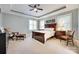 Bedroom features a tray ceiling, neutral carpet, and a dark wood furniture set at 125 Highland Forest Dr, Clover, SC 29710