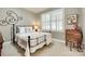 Bedroom features neutral carpet, grey walls, and a small desk near window at 125 Highland Forest Dr, Clover, SC 29710