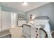 Bedroom features a white metal bed frame, neutral carpet, and view into hall at 125 Highland Forest Dr, Clover, SC 29710