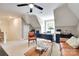 Angled ceilings and neutral colors create a stylish and functional bonus room at 125 Highland Forest Dr, Clover, SC 29710