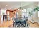 Bright dining area adjacent to the kitchen with hardwood flooring, large windows, and ample seating at 125 Highland Forest Dr, Clover, SC 29710