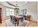 Inviting dining area with hardwood floors, a large window, and stylish chandelier at 125 Highland Forest Dr, Clover, SC 29710