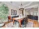Elegant dining room with a hardwood table, decorative rug, and view into a cozy Gathering room at 125 Highland Forest Dr, Clover, SC 29710