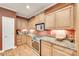 Charming kitchen boasts granite countertops, stainless steel appliances, and wood cabinetry at 125 Highland Forest Dr, Clover, SC 29710