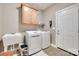 Functional laundry room with a sink, washer, dryer, and ample storage space at 125 Highland Forest Dr, Clover, SC 29710