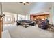Bright, open living space with a vaulted ceiling, leather furniture, and connection to the kitchen at 125 Highland Forest Dr, Clover, SC 29710