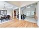 Open-concept living and dining area with hardwood floors, pillars, and natural light at 125 Highland Forest Dr, Clover, SC 29710