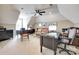 Spacious home office with multiple desks, leather seating, and a ceiling fan at 125 Highland Forest Dr, Clover, SC 29710