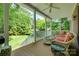 Covered porch with wicker furniture, ceiling fan, and a view of the backyard at 125 Highland Forest Dr, Clover, SC 29710