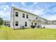 This well-maintained backyard showcases a bright lawn, grill, patio, and charming fence, perfect for relaxing or entertaining guests at 139 Suggs Mill Dr, Mooresville, NC 28115