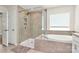 Beautiful bathroom with tile floors, granite counters, soaking tub, and glass shower at 139 Suggs Mill Dr, Mooresville, NC 28115