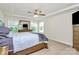 Spacious bedroom featuring tray ceilings, ceiling fan and natural light at 139 Suggs Mill Dr, Mooresville, NC 28115
