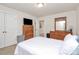 Cozy bedroom with natural wooden furniture, neutral colors, and soft carpet at 139 Suggs Mill Dr, Mooresville, NC 28115