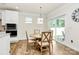 Eat-in kitchen and dining area with sliding glass doors and wood-look flooring at 139 Suggs Mill Dr, Mooresville, NC 28115