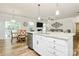 Open floor plan with kitchen island, granite counters, stainless appliances, and breakfast area at 139 Suggs Mill Dr, Mooresville, NC 28115