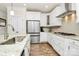 Bright kitchen features stainless steel appliances, granite countertops, and white cabinetry at 139 Suggs Mill Dr, Mooresville, NC 28115