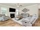 Cozy living room features a fireplace, ceiling fan, and comfortable seating at 139 Suggs Mill Dr, Mooresville, NC 28115