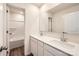 Modern bathroom featuring double sinks with white countertops and a large mirror at 140 Astor St, Troutman, NC 28166