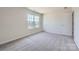Bright, carpeted bedroom with a large window and ample natural light creates a cozy atmosphere at 140 Astor St, Troutman, NC 28166