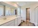 Bathroom featuring a double vanity with modern fixtures, framed mirror, and separate shower stall at 144 Astor St, Troutman, NC 28166