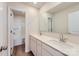 Bathroom featuring double vanity, a large mirror, and a separate door to the toilet and shower area at 144 Astor St, Troutman, NC 28166