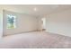 Bright bedroom with neutral carpet and large window, perfect for relaxation and natural light at 144 Astor St, Troutman, NC 28166