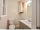 Cozy bathroom with stylish gray vanity and patterned floor at 1513 Greenview Pl, Charlotte, NC 28208