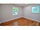Bright bedroom with hardwood floors and dual windows at 1513 Greenview Pl, Charlotte, NC 28208