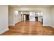 Spacious living room with open layout, hardwood floors, and a clear view into the modern kitchen at 1513 Greenview Pl, Charlotte, NC 28208