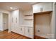 Large pantry area with built-in cabinets and hardwood floors, offering ample storage space at 1513 Greenview Pl, Charlotte, NC 28208