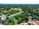 Expansive aerial view of a residential area with homes surrounded by mature trees and green spaces at 1520 21St Ne Ave, Hickory, NC 28601