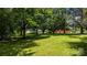 Large backyard with mature trees providing ample shade and privacy at 1520 21St Ne Ave, Hickory, NC 28601
