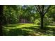 Large backyard with mature trees providing ample shade at 1520 21St Ne Ave, Hickory, NC 28601
