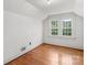 Bright bedroom with hardwood floors and natural light from double windows at 1520 21St Ne Ave, Hickory, NC 28601