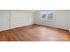 Bright, spacious bedroom features hardwood floors and large windows offering plenty of natural light at 1520 21St Ne Ave, Hickory, NC 28601