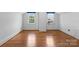 Bright bedroom with hardwood floors and two windows that provide natural light, creating a welcoming and cozy ambiance at 1520 21St Ne Ave, Hickory, NC 28601