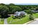 Beautiful brick home with lush greenery and a driveway leading to a detached garage at 1520 21St Ne Ave, Hickory, NC 28601