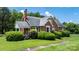 Charming brick home with lush landscaping, a neatly manicured lawn, and inviting curb appeal at 1520 21St Ne Ave, Hickory, NC 28601