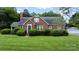 Charming brick home with a well-manicured front lawn and mature landscaping at 1520 21St Ne Ave, Hickory, NC 28601