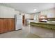 Bright kitchen with ample space, featuring a refrigerator, washer, dryer, and view to other rooms in the home at 1520 21St Ne Ave, Hickory, NC 28601