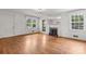 Cozy living room with hardwood floors, fireplace, and ample natural light from large windows, creating a welcoming space at 1520 21St Ne Ave, Hickory, NC 28601