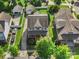 Charming two-story home with a covered porch, well-manicured lawn, and long driveway leading to detached garage at 17327 Summers Walk Blvd, Davidson, NC 28036