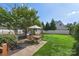 Well-manicured backyard with lush green lawn, patio furniture, and a privacy fence at 17327 Summers Walk Blvd, Davidson, NC 28036