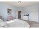 Bedroom featuring soft blue walls, plush carpet, and natural light at 17327 Summers Walk Blvd, Davidson, NC 28036